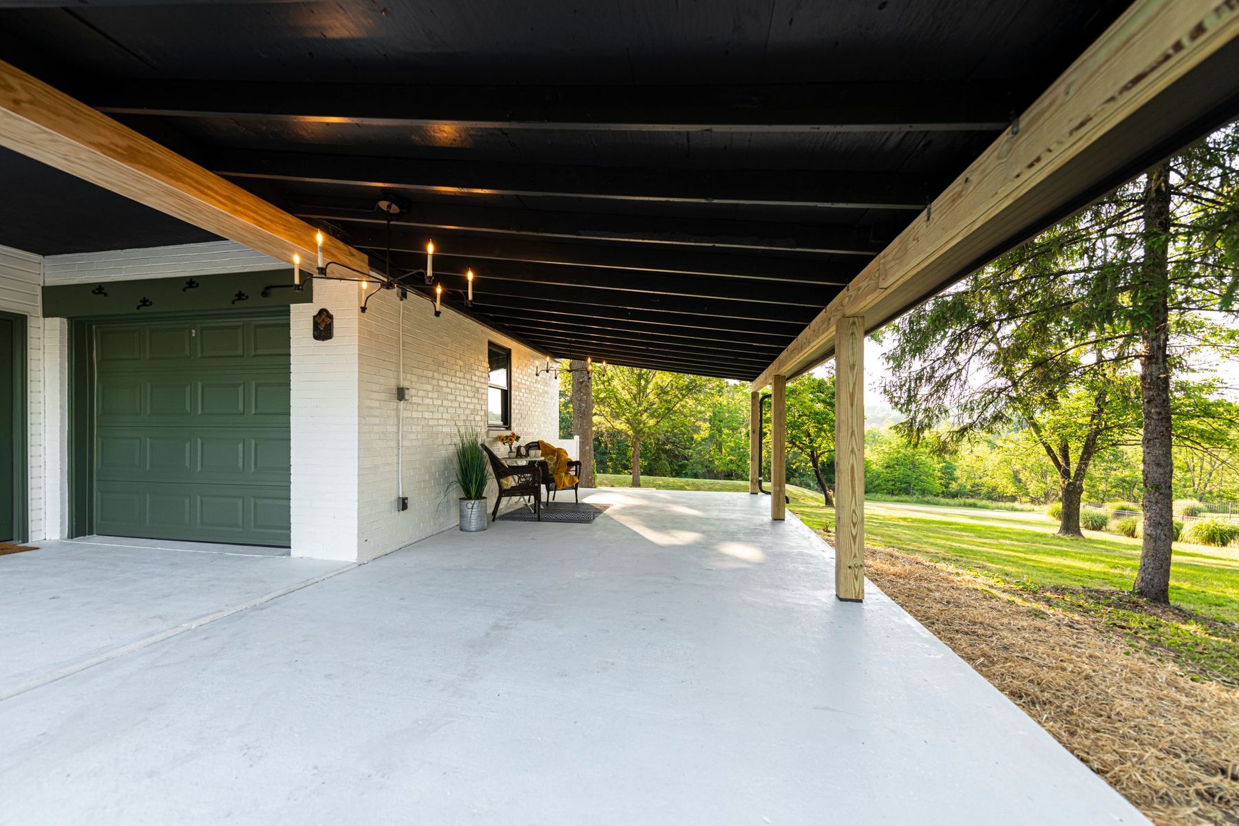 Covered outdoor patio addition with ceiling fan and recessed lighting — Pinpoint Home Services exterior build