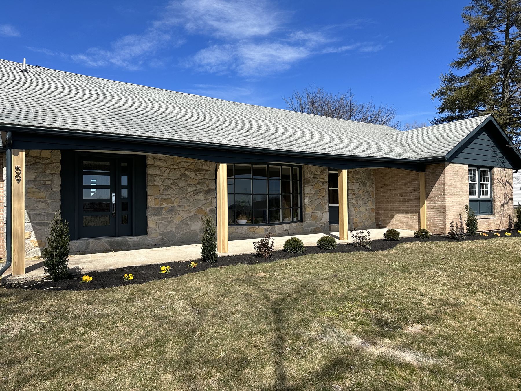 Stone-sided ranch home exterior renovation — Pinpoint Home Services