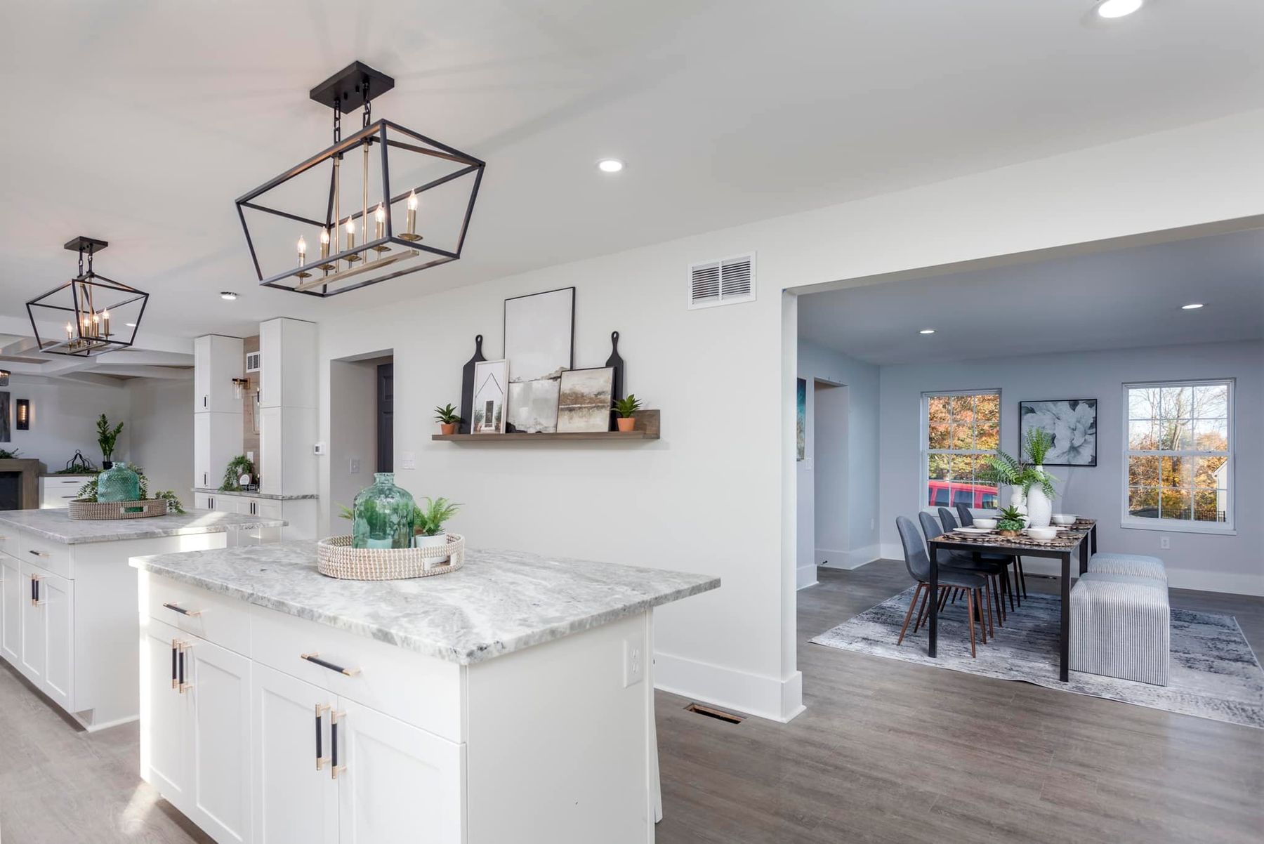 Classic white kitchen renovation with wide marble island — Pinpoint Home Services, Collegeville PA